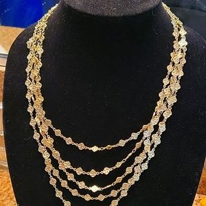 Gold fashion multi strand necklace. New, never worn, with tags.